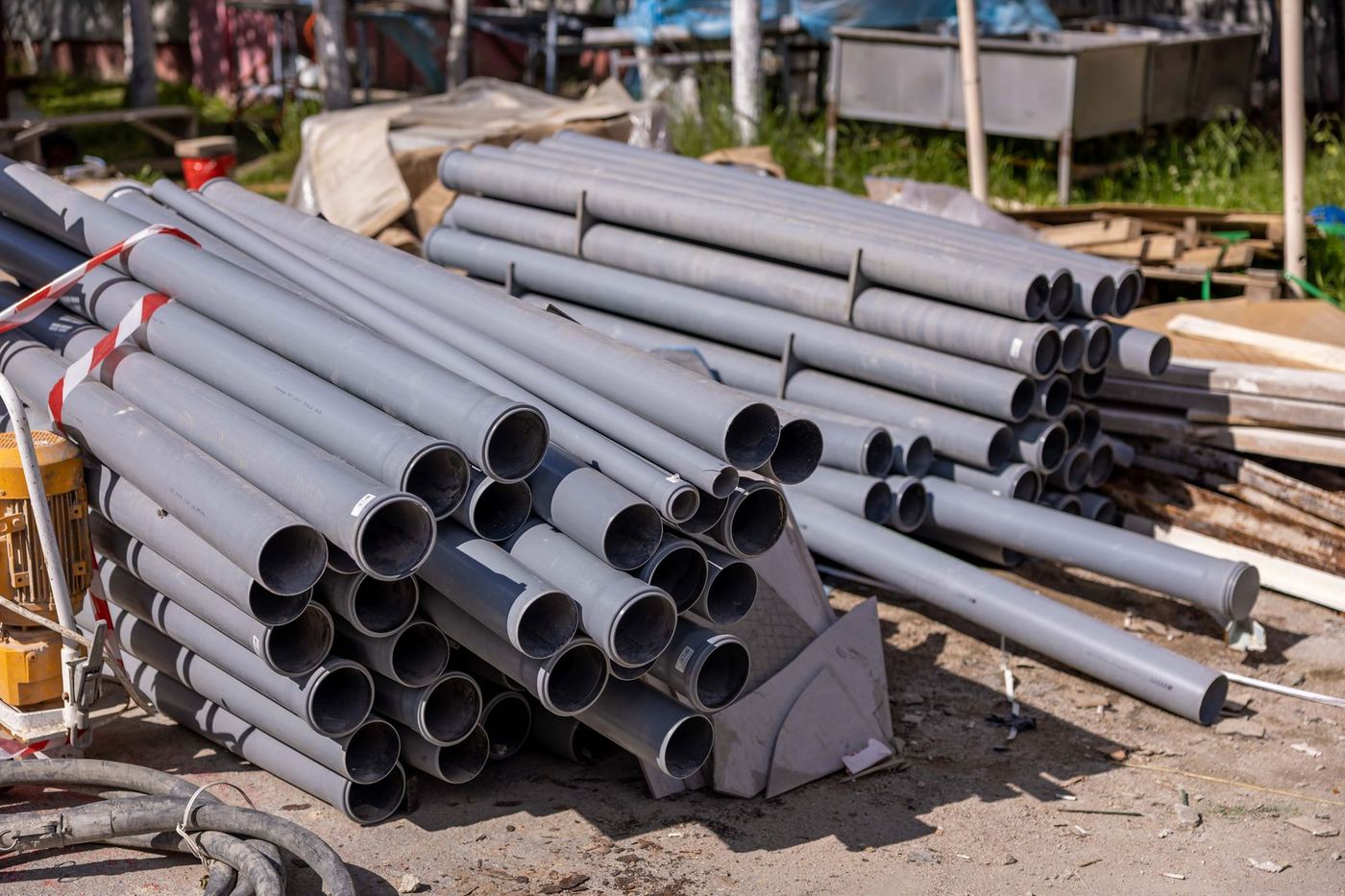 Stack of PVC pipes at a job site