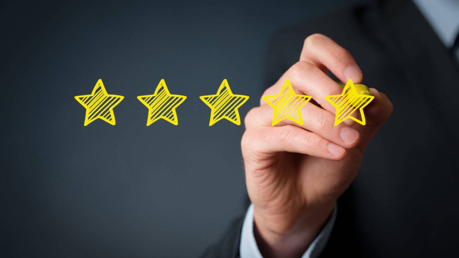 Hand drawing five gold rating stars