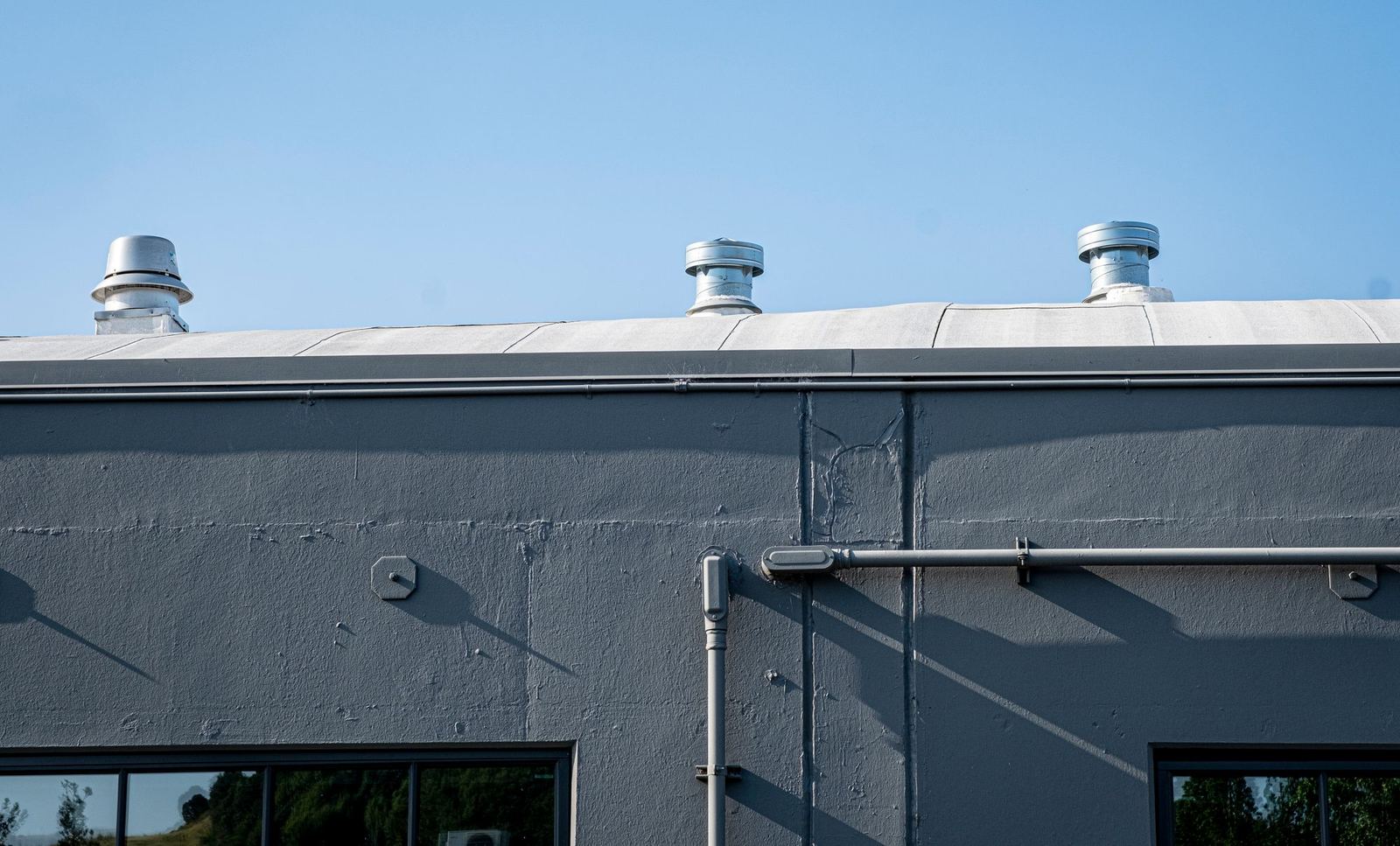 Commercial building with vent stacks on the roof