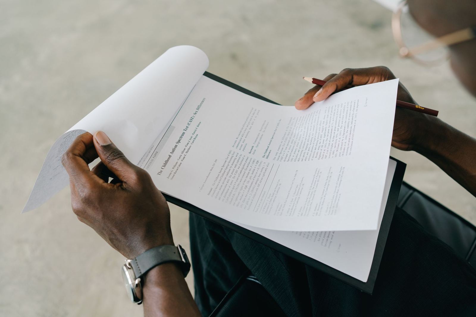 Person reviewing a printed report